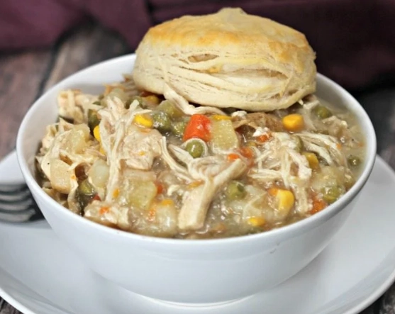 Chicken pot pie in a crock pot with biscuits