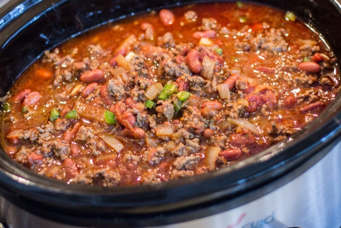 Do you have to brown the meat before you put it in the crockpot for chili?